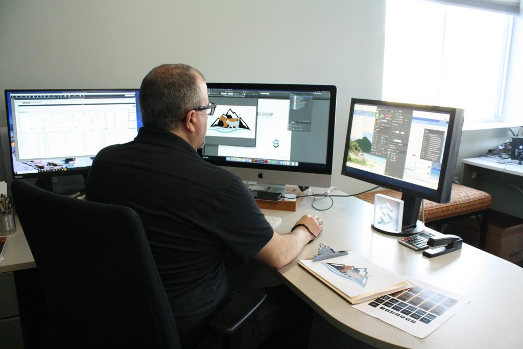 Photo showing designer at computer